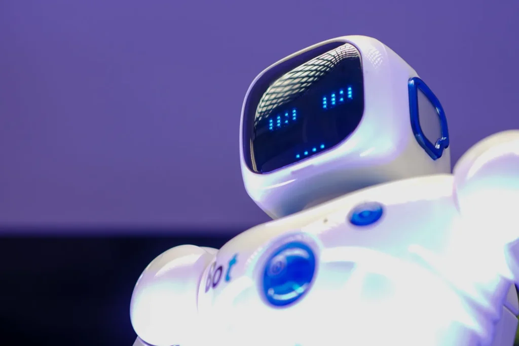 White humanoid robot against a purple background