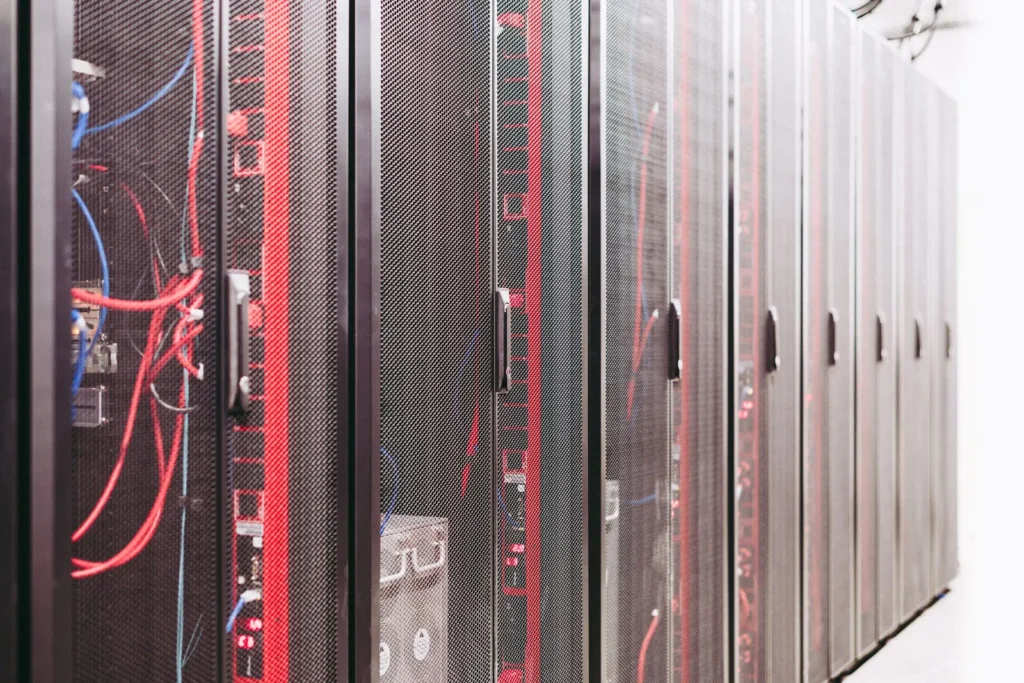 Rows of server cabinets with red cabling