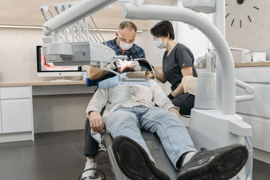 Dental team caring for a patient in a modern clinic