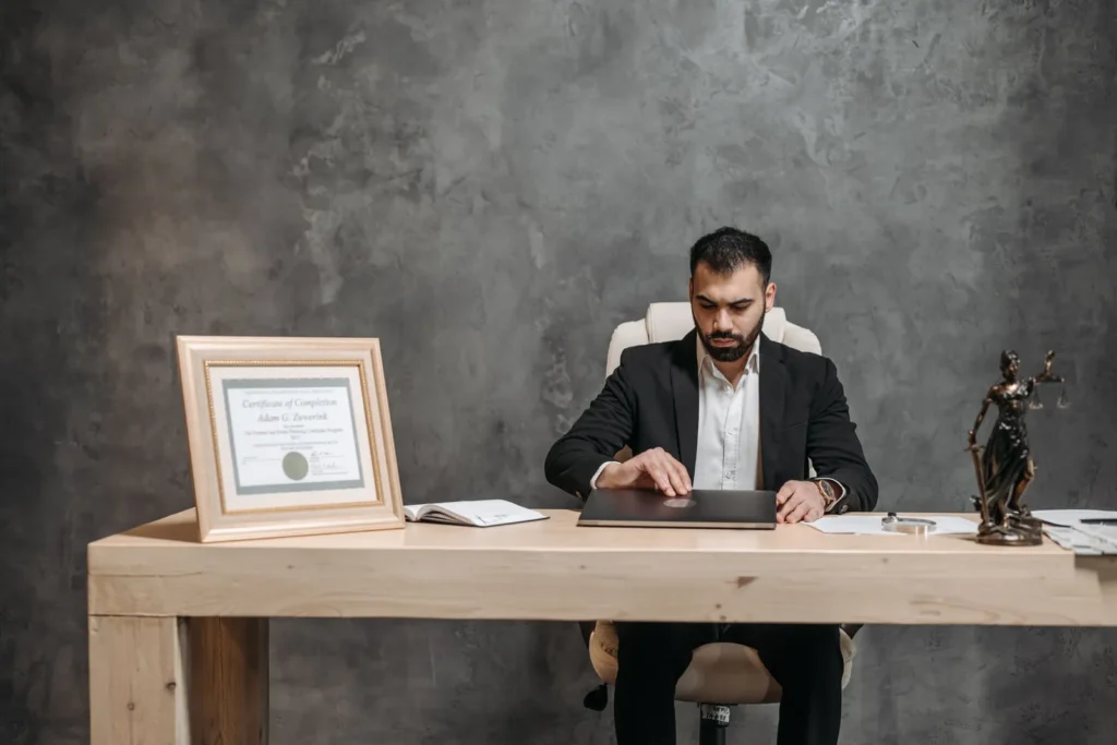 Lawyer working at a desk with a laptop in a modern office