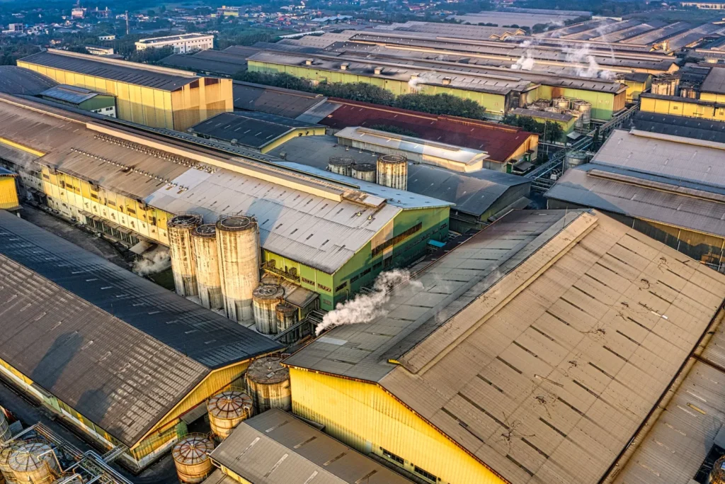 Aerial view of warehouses and industrial buildings at golden hour