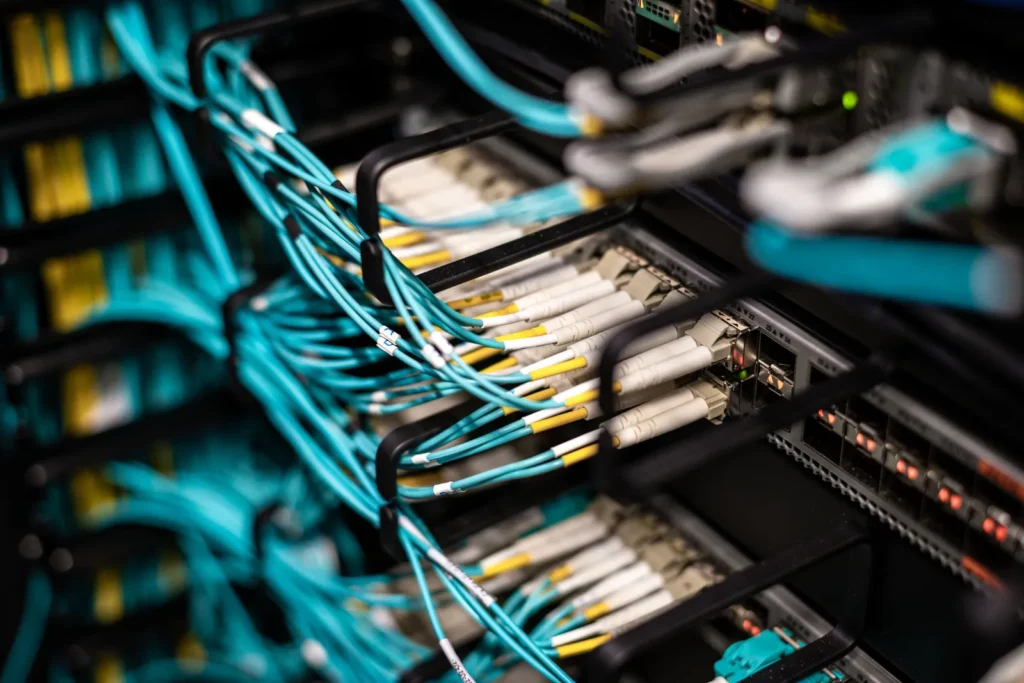 Fibre cables plugged into a network patch panel